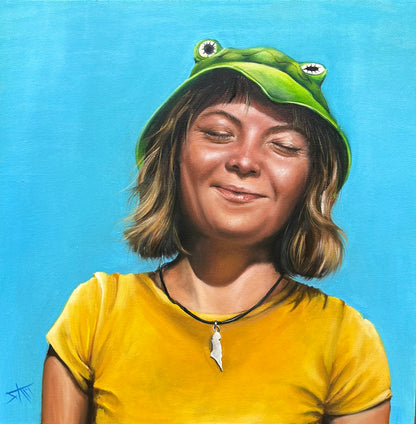 Original 20x20 oil painting titled Greta, featuring a young woman in a green frog hat, vibrant yellow shirt, and blue background.