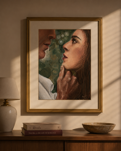 A framed portrait painting of a man and woman facing each other, displayed on a beige wall above a wooden console table with a lamp, books, and a bowl.
